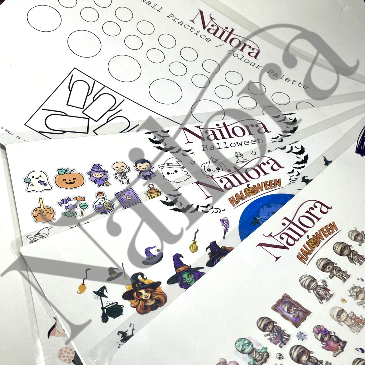 Several printed nail practice sheets with Halloween-themed illustrations are arranged on a white surface. The sheets show black-and-white circular and shape practice areas plus small color options, and other sheets feature cartoon ghosts, pumpkins, witches, bats, and spooky accessories. watermarked Nailora