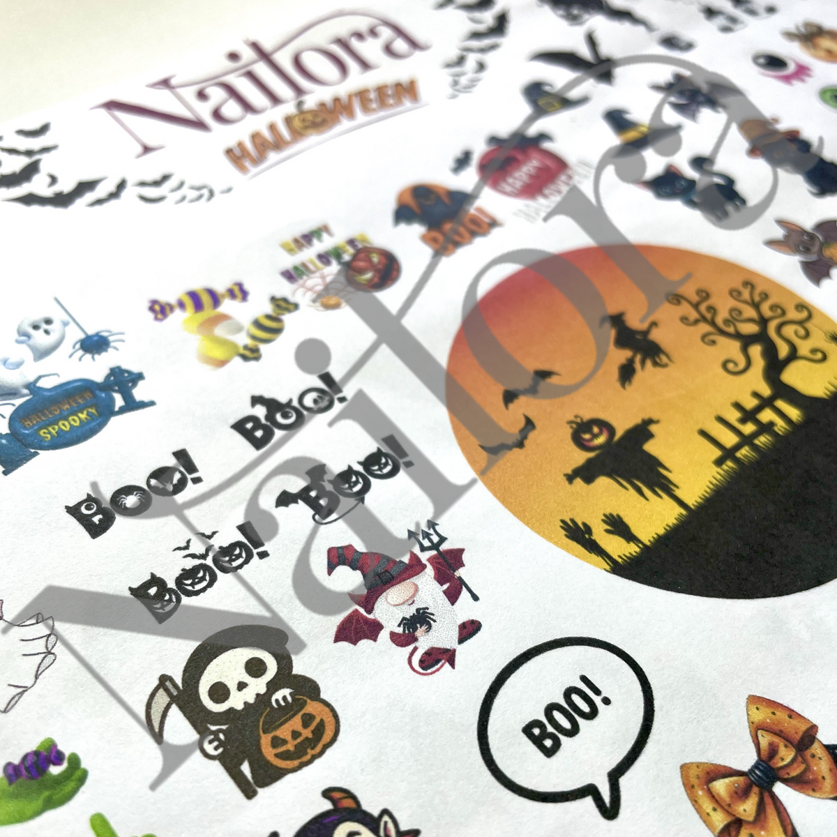 A close-up of a printed Nailora Halloween DIY sticker sheet featuring various spooky illustrations including a witch, ghost, pumpkin, bats, and a large orange moon graphic, with a large translucent Nailora watermark across the image.