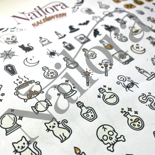 A close-up of a white nail art sheet featuring Halloween-themed illustrations, including skulls, cauldrons, bats, spiders, and candles, with the brand name Nailora and the collection name HALLOWEEN printed at the top.