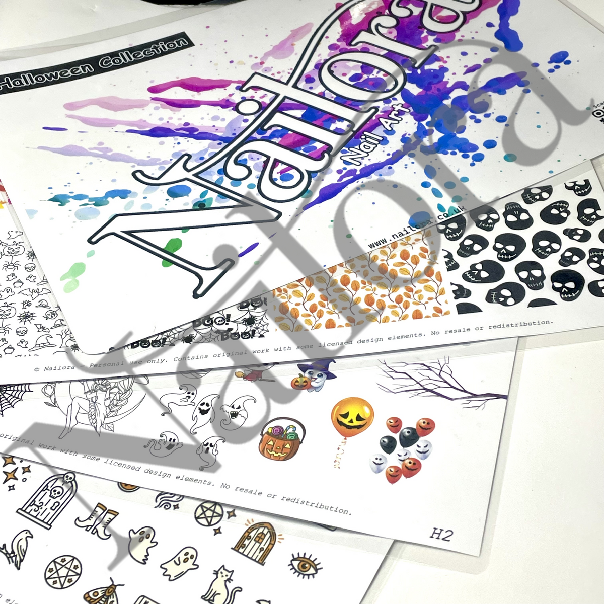 A stack of printed Halloween-themed sticker or decal sheets with spooky illustrations and patterns, including ghosts, pumpkins, skulls, and splatter designs. The sheets are partially overlaid with a large translucent watermark reading 'Nailora'.
