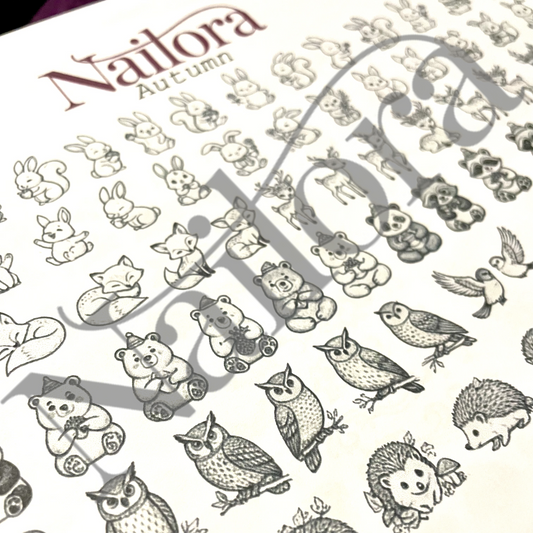 A close-up of a nail art sheet featuring autumn-themed animal illustrations, including bears, owls, rabbits, squirrels, and birds. The brand name 'Nailora Autumn' is printed at the top, and a large diagonal watermark overlays the design.