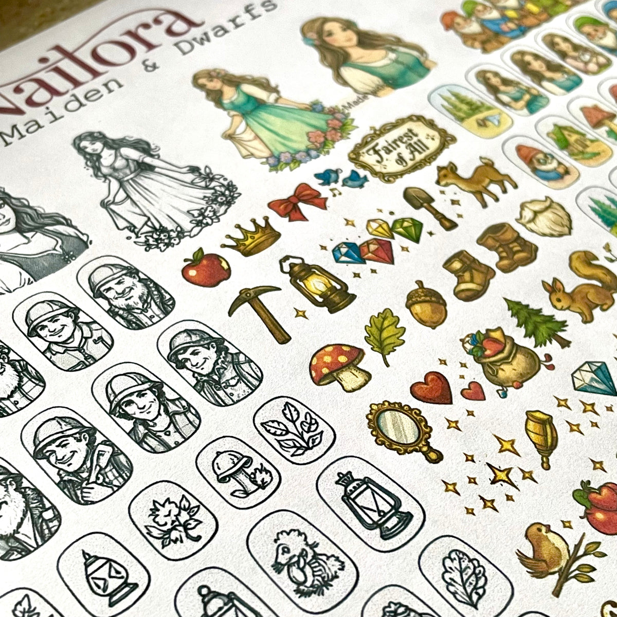 A close-up of a printed sheet featuring illustrated nail art designs, including woodland-themed icons such as acorns, mushrooms, leaves, lanterns, bows, crowns, and fantasy character portraits labeled Nailora Maiden & Dwarfs. Nail making decal sticker sheet by Nailora